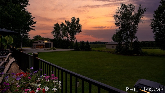 yard at dusk with an outdoor structure