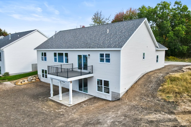 back of house with a patio area