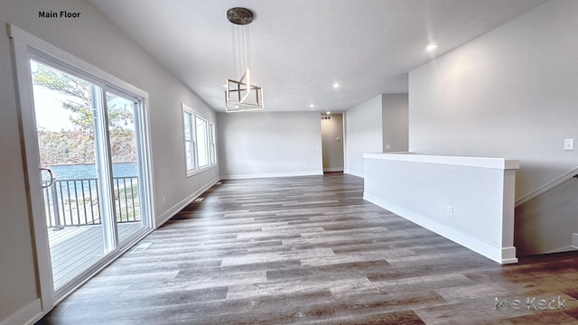 unfurnished dining area featuring wood-type flooring