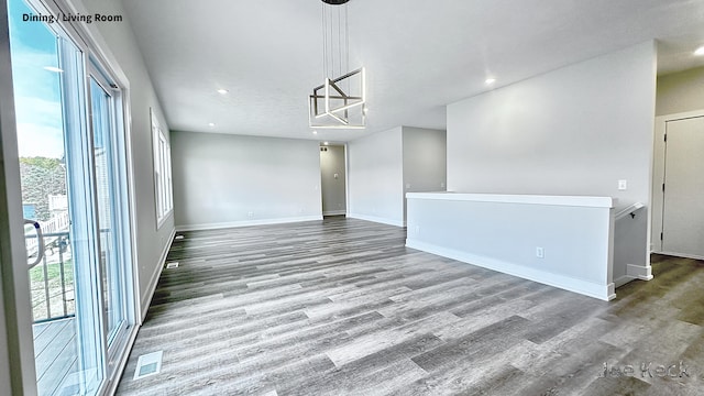 unfurnished dining area with wood-type flooring