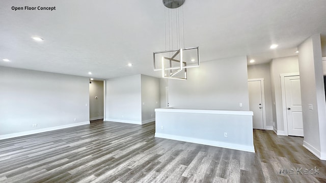 empty room with dark wood-type flooring