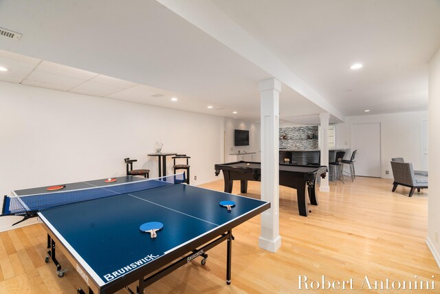 rec room featuring a paneled ceiling, pool table, and light hardwood / wood-style floors