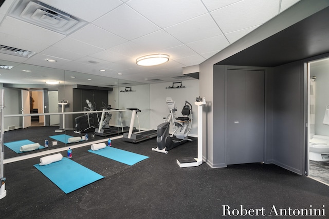 exercise room featuring a drop ceiling