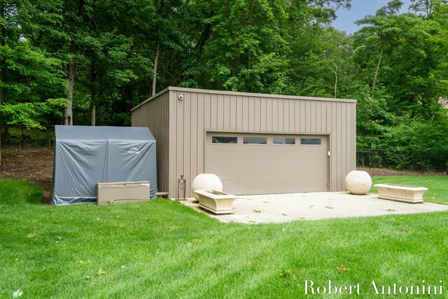 garage with a lawn