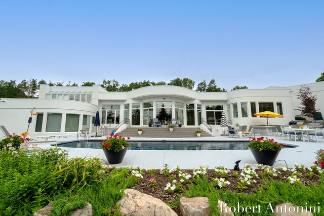 rear view of property featuring a patio