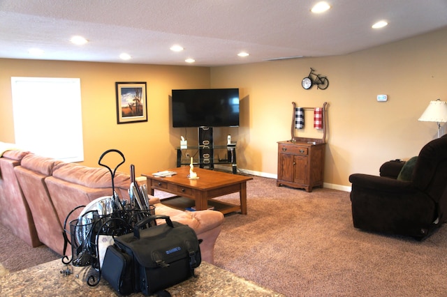 carpeted living room featuring a textured ceiling