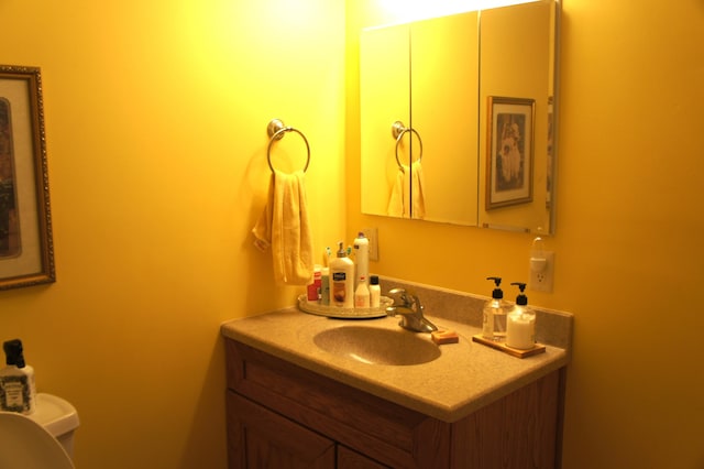 bathroom with vanity and toilet