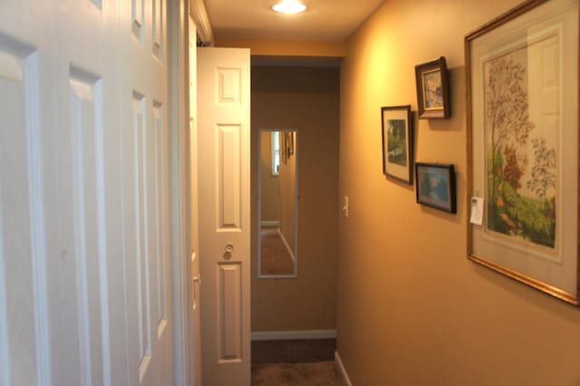 corridor with a textured ceiling