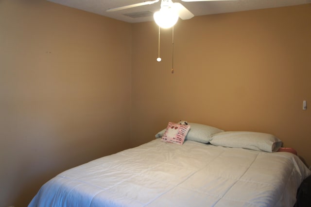 bedroom featuring ceiling fan