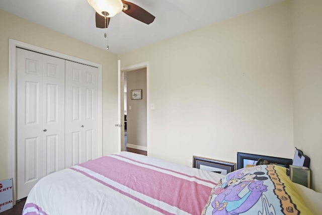 bedroom with ceiling fan and a closet