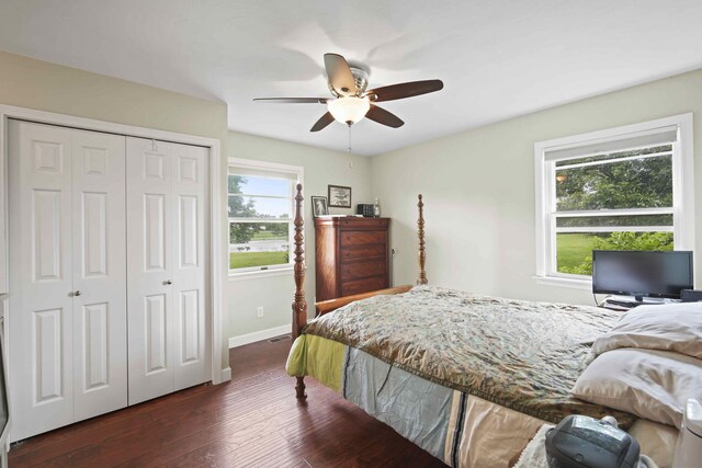 bedroom with dark wood-type flooring, a closet, and ceiling fan