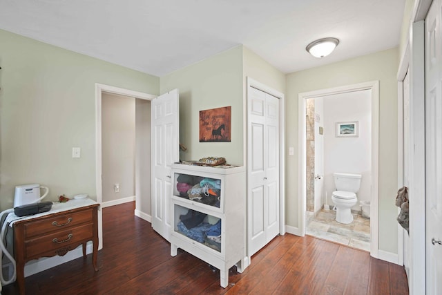 hallway with dark hardwood / wood-style flooring