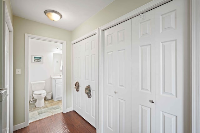 hallway featuring dark hardwood / wood-style floors