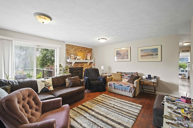 living room with a healthy amount of sunlight, a fireplace, and dark hardwood / wood-style flooring