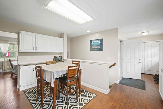 dining area with dark hardwood / wood-style flooring