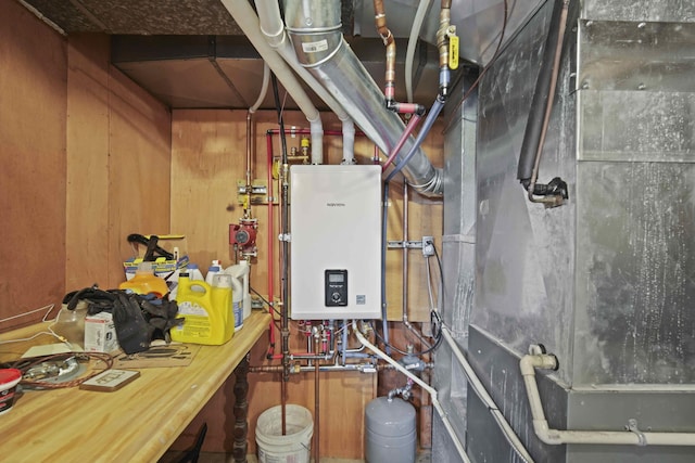 utility room with tankless water heater