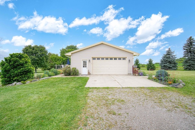 exterior space featuring a garage and a lawn