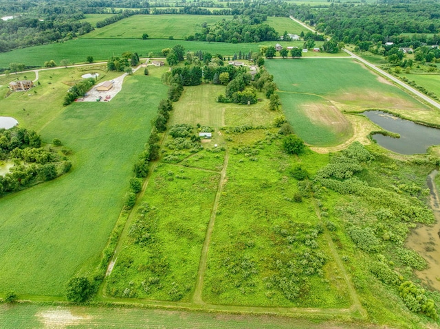 drone / aerial view with a water view and a rural view