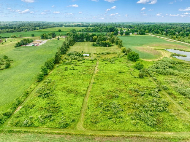 birds eye view of property with a rural view