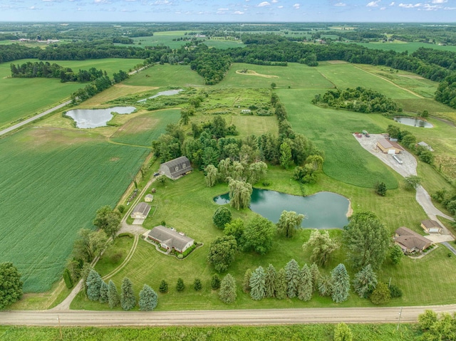 aerial view with a water view and a rural view