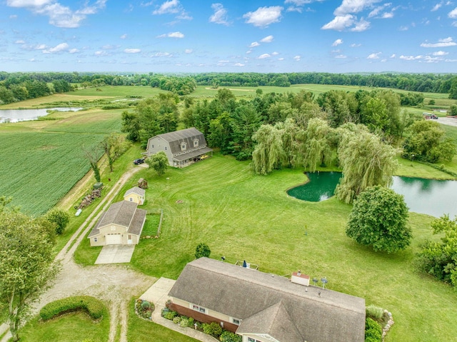 birds eye view of property with a water view and a rural view