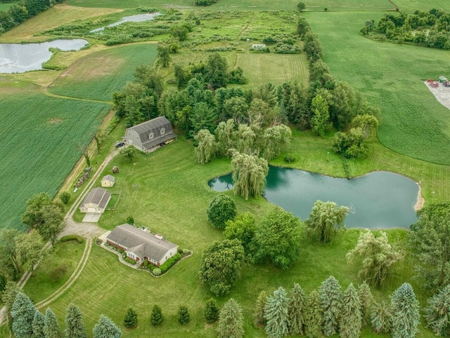 drone / aerial view featuring a rural view and a water view