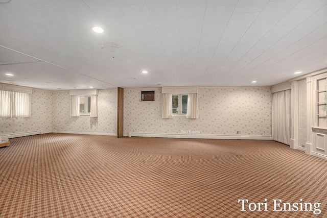 basement with carpet floors and baseboard heating