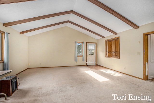 unfurnished living room featuring lofted ceiling and light carpet