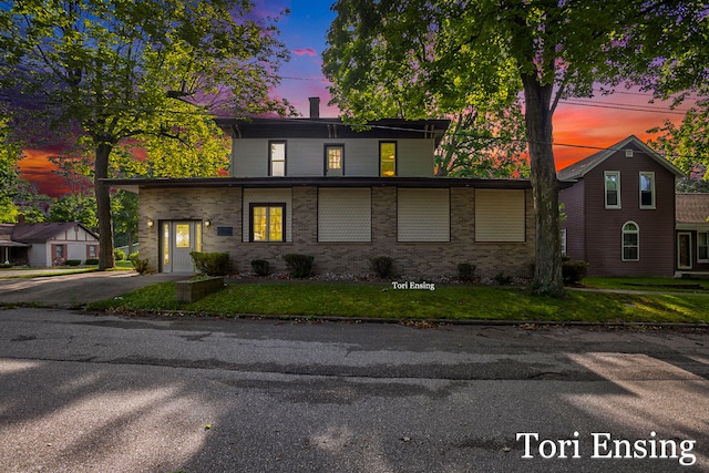 view of property featuring a lawn