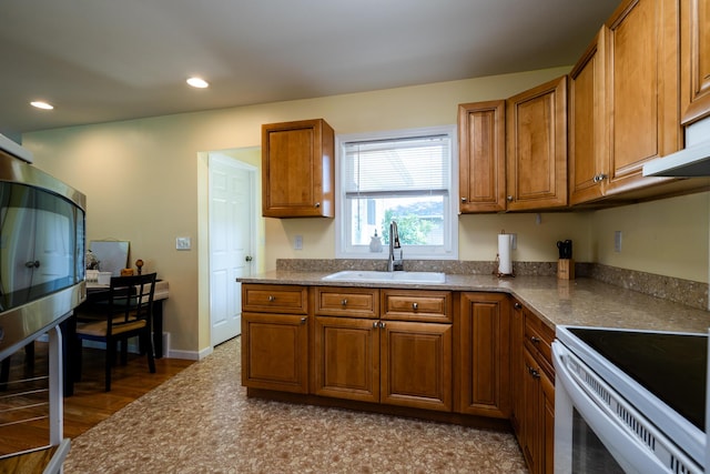 kitchen featuring sink and white range with electric stovetop