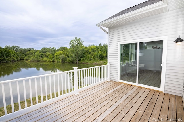 wooden terrace with a water view