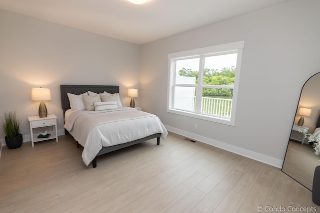 bedroom with light hardwood / wood-style floors