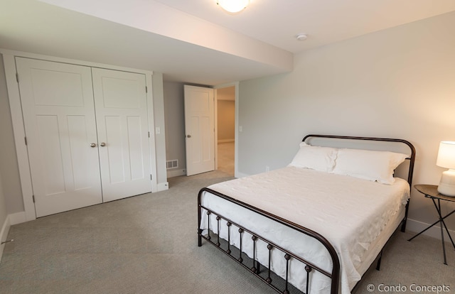 carpeted bedroom with a closet