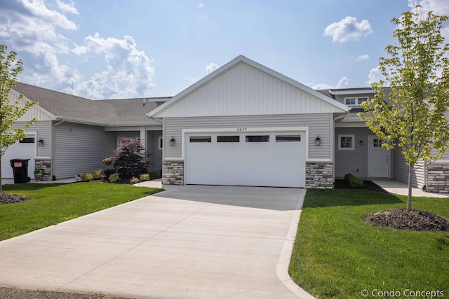 view of front of home with a garage and a front yard