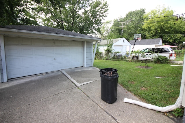 garage featuring a yard