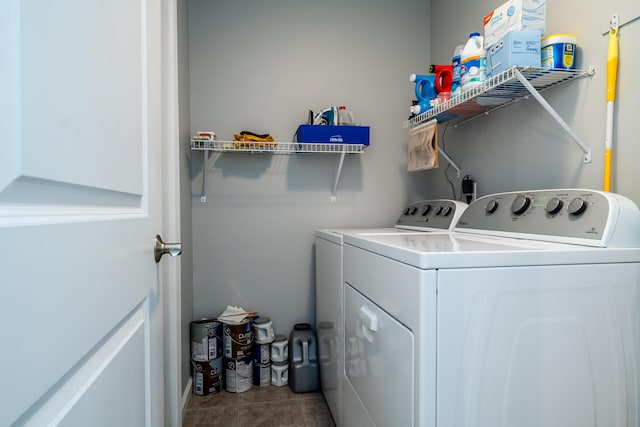 laundry room with separate washer and dryer and tile patterned floors