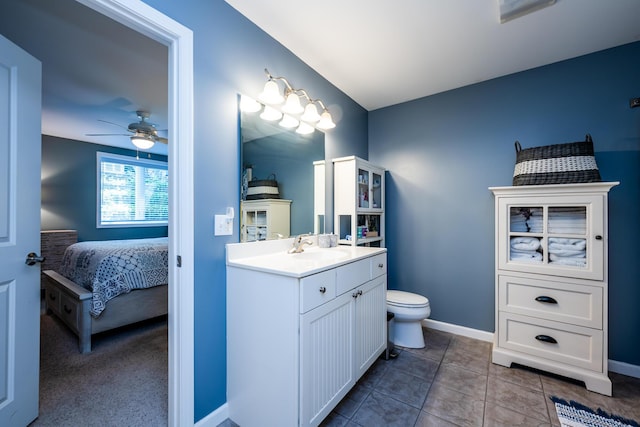 bathroom with vanity, tile patterned floors, toilet, and ceiling fan