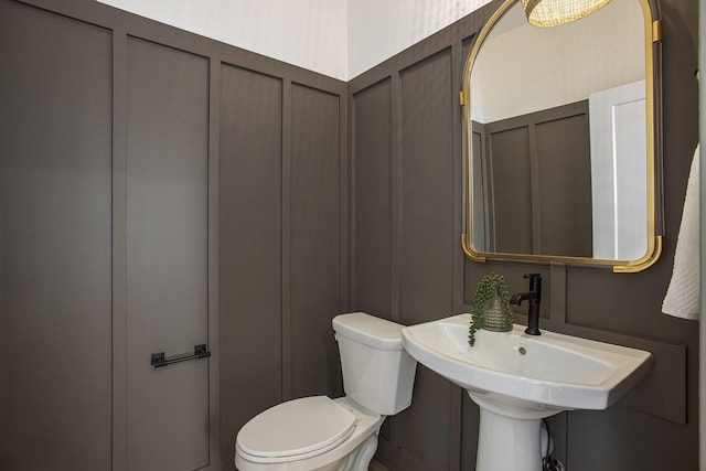 bathroom with toilet and sink