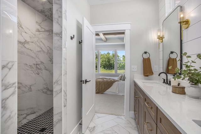 bathroom with vanity, beam ceiling, and a shower