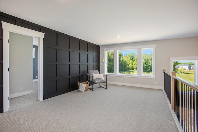 living area featuring light colored carpet