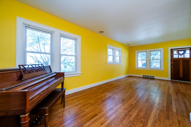 entryway with hardwood / wood-style floors