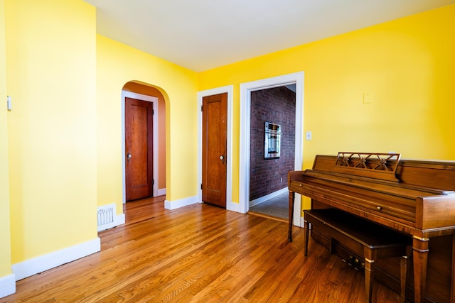 miscellaneous room featuring hardwood / wood-style flooring