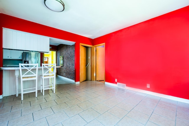 interior space with light tile patterned floors