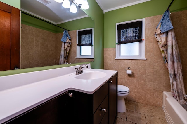 full bathroom featuring shower / bath combo, crown molding, toilet, vanity, and tile walls