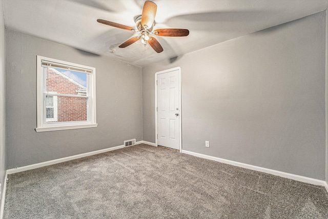 spare room with ceiling fan and carpet floors