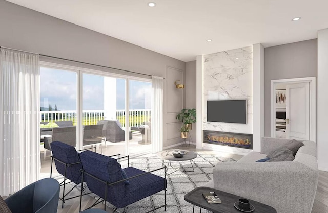 living room featuring a fireplace and light hardwood / wood-style flooring