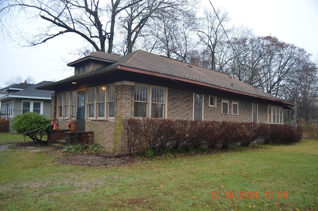 view of property exterior featuring a yard