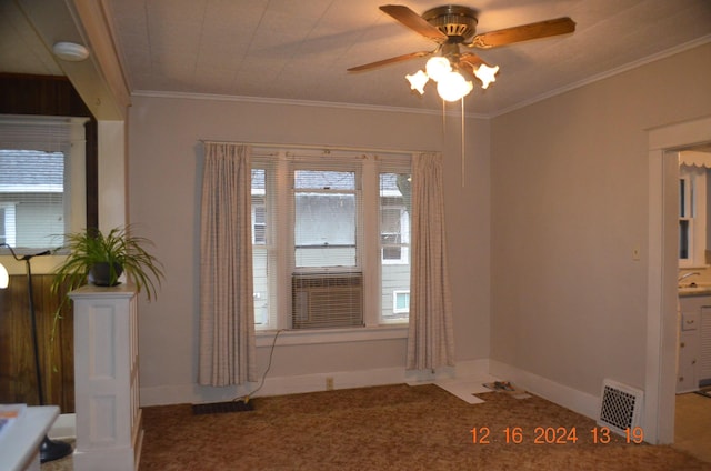 unfurnished room featuring crown molding and ceiling fan