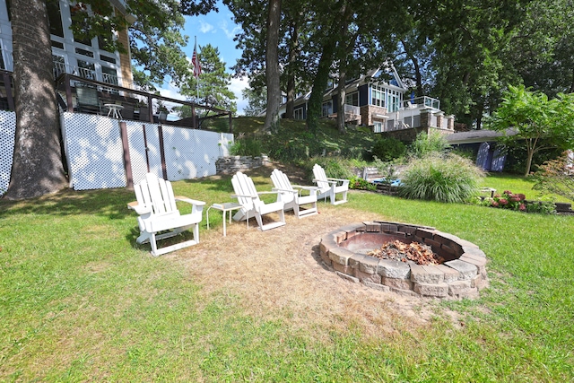 view of yard with an outdoor fire pit