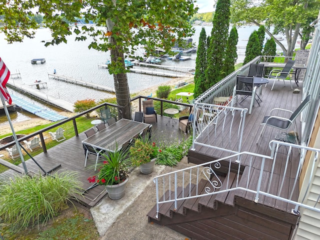 exterior space featuring a boat dock and a water view